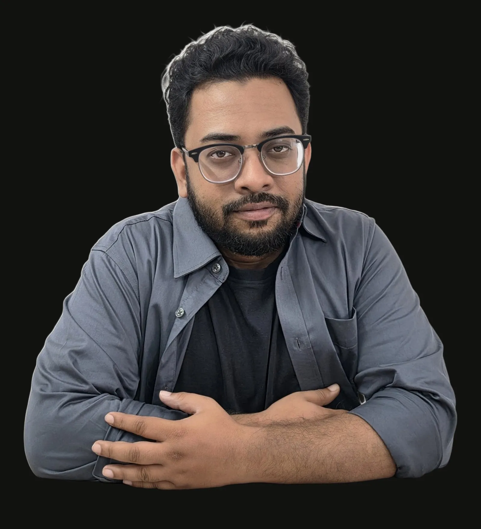 Shahriar Sultan, studio portrait with arms folded